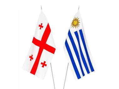 Beyaz arka planda Gürcistan ve Uruguay Doğu Cumhuriyeti 'nin ulusal kumaş bayrakları izole edildi. 3d resimleme.