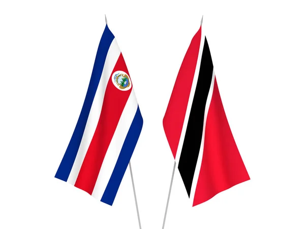 トリニダード トバゴ共和国とコスタリカ共和国の国旗が白地に隔離されている 3Dレンダリング図 — ストック写真