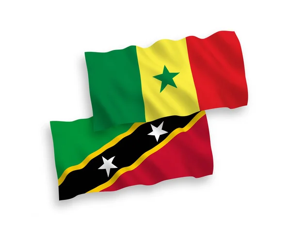 圣克里斯托弗和尼维斯联邦和塞内加尔共和国的国家病媒织物波条旗在白色背景下隔离 1比2的比例 — 图库矢量图片