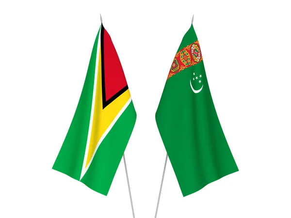 National fabric flags of Turkmenistan and Co-operative Republic of Guyana isolated on white background. 3d rendering illustration.
