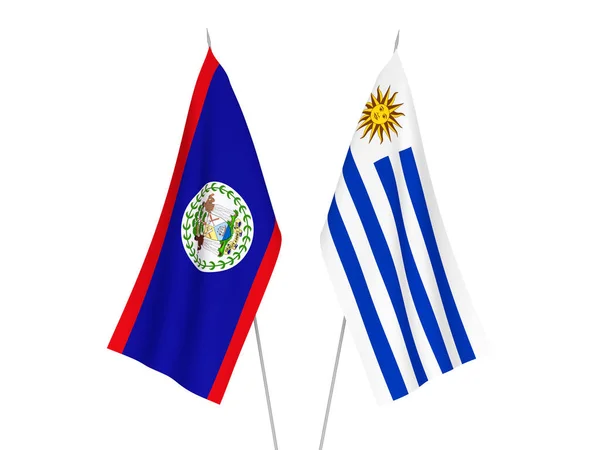 우루과이와 벨리즈 의동양 공화국의 국가적 깃발들은 바탕에 세워져 있었습니다 렌더링 — 스톡 사진