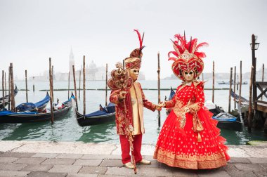 Beautiful colorful masks at traditional Venice Carnival in Venice, Italy