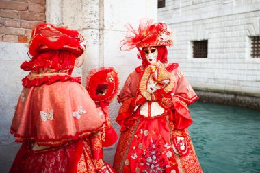 Beautiful colorful masks at traditional Venice Carnival in Venice, Italy