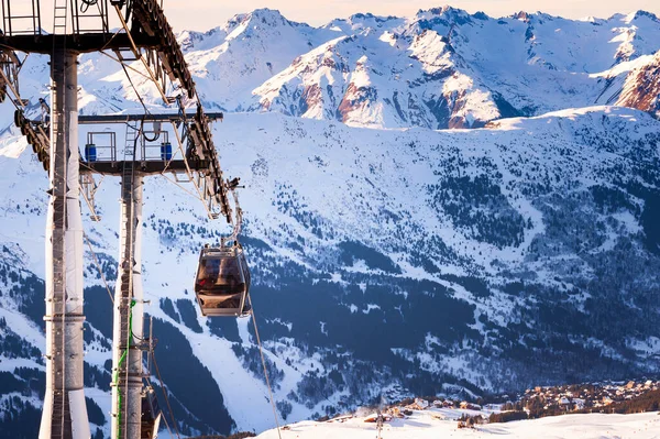 Gondola lift in ski resort in winter Alps mountains, France. Meribel, France. Winter landscape