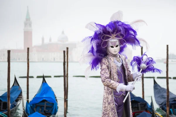 Beautiful colorful masks at traditional Venice Carnival in Venice, Italy