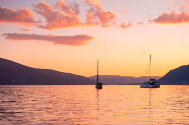 Yacht in the Kotor bay, Montenegro. Summer landscape at sunset. Travel and vacation concept