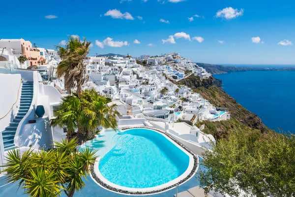 White architecture in Santorini island, Greece. Luxury swimming pool with sea view. Travel and summer vacation concept