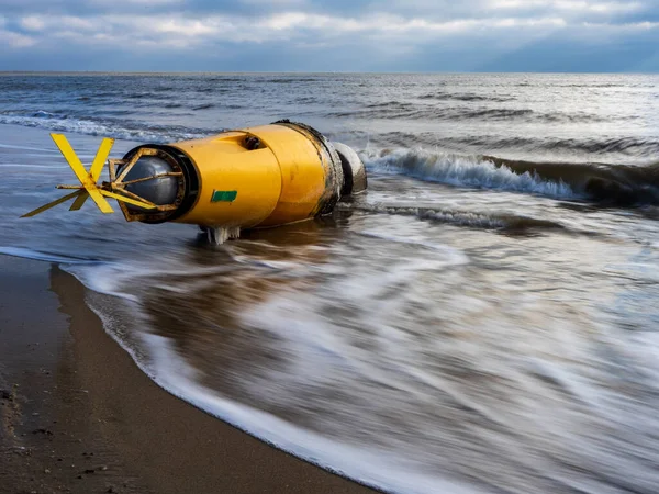 stock image sea buoy washed ashore after a storm 