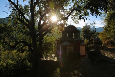 Small church nearby Iviron monastery as seen from the trail connecting it to Karyes in Mont Athos clipart