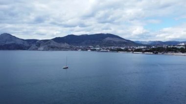 Aerial footage above yacht in Sudaks city bay in Crimea, 4k drone footage