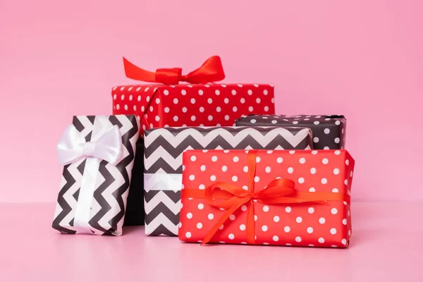 stock image Merry Christmas, New year and sale event concept. Gift boxes with ribbon bow on pink background.