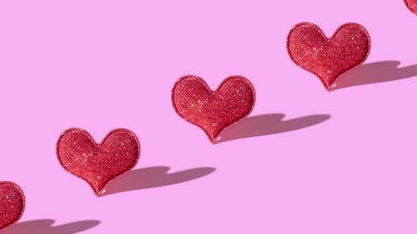 Patrón Con Forma Corazón Purpurina Roja Sobre Fondo Rosa Con — Vídeos de Stock
