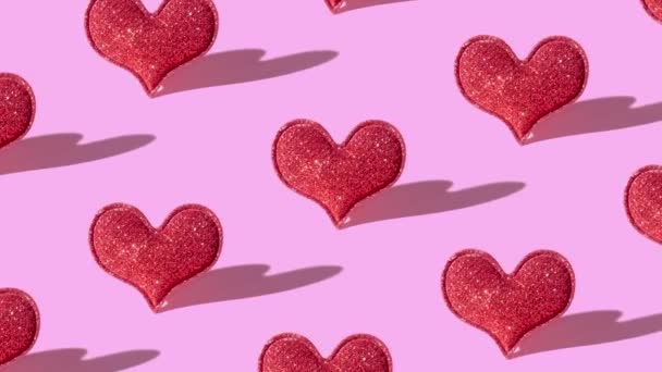 Patrón Con Forma Corazón Purpurina Roja Sobre Fondo Rosa Con — Vídeo de stock