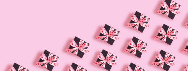 Valentines Day background with pattern from present gift box with bow top view.