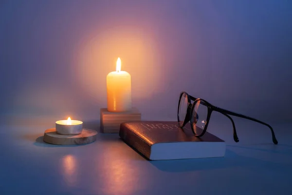 Glasses Bible Candle Flame Dark — 图库照片