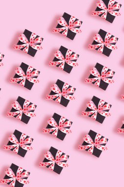 Valentines Day background with pattern from present gift box with bow top view.