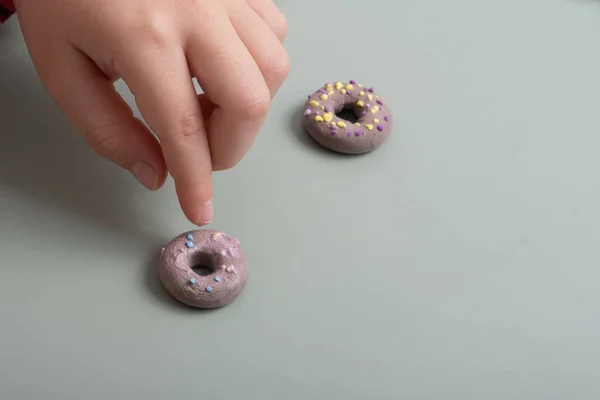 Creating a doll cake donut from air plasticine. Children\'s creativity DIY.