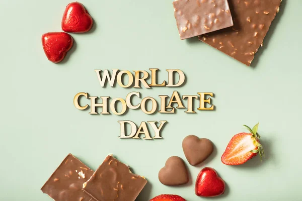 Texto Dia Mundial Chocolate Com Deitado Plano Chocolate Vista Superior — Fotografia de Stock