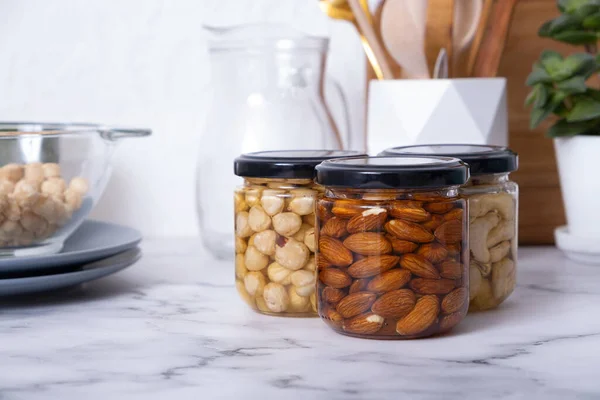 Glass Jars Honey Nuts Almonds Hazelnuts Cashew Honey Kitchen Interior — Stock Photo, Image