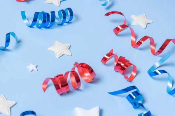 stock image USA Independence day concept. Red and blue spirals and white stars elements of USA flag on blue background. Variative focus