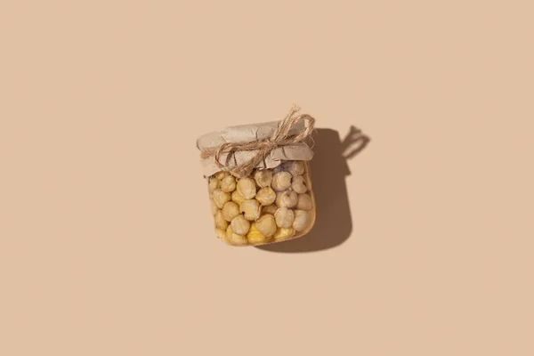 Glazen Pot Met Honing Noten Beige Ondergrond Zoet Voedsel — Stockfoto