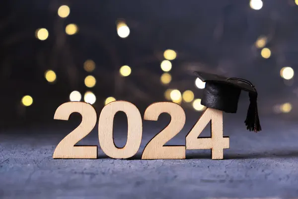 2024年のコンセプト 2024 卒業したキャップとボケのライト ストックフォト