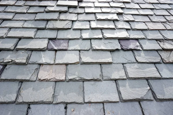 Slate roofing tiles on a historic building. Slate is a traditional building material known for exceptional durabilty.