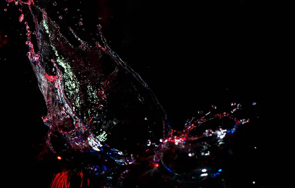 Színes Fröccsenő Víz Fekete Háttér Stock Kép