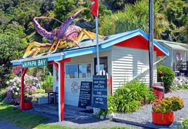 Kaikoura, New Zealand - December 14, 2014: Iconic Waipapa Bay Crayfish & Lobster Restaurant & Shop. clipart