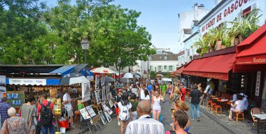 Paris, France - Julyl 24, 2013; Art Market at Montmatre with stalls, cafes and lots of tourists. clipart