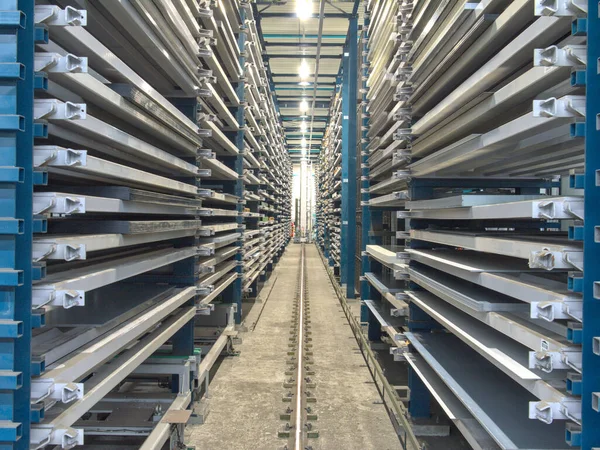 Fully automatic high bay warehouse for sheet metal