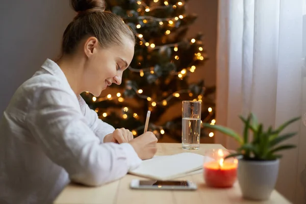 Indoor Shot Young Adult Woman Writing Resolutions New Year Notebook — Stock Photo, Image