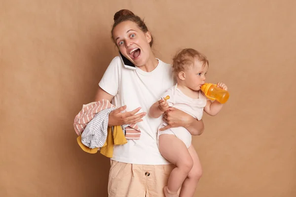 Indoor Shot Amazed Excited Joful Mother Her Baby Standing Talking —  Fotos de Stock