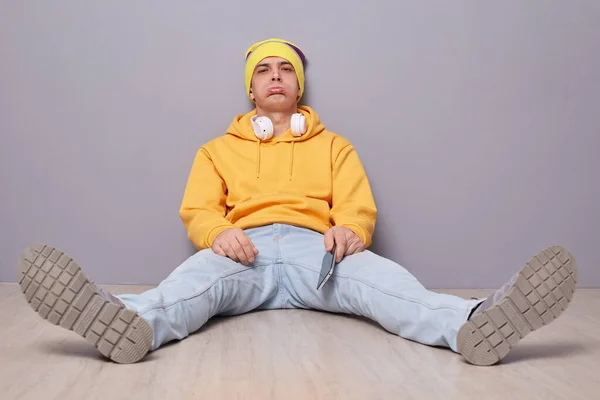 Indoor Shot Sad Unhappy Man Wearing Beanie Hat Yellow Hoodie — Φωτογραφία Αρχείου