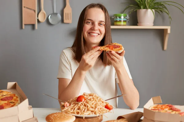 Indoor Shot Happy Girl Eating Pizza Holding Pizza Her Hand — Stock fotografie