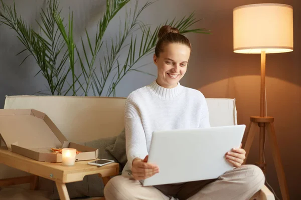 Smiling Joyful Attractive Woman Bun Hairstyle White Sweater Looking Laptop — Stock Photo, Image