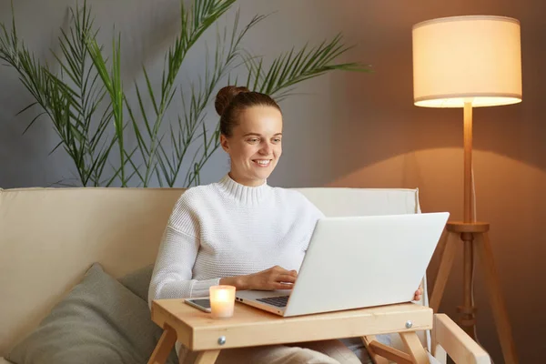 Optimistic Joyful Positive Woman Bun Hairstyle White Sweater Looking Laptop — Stock Photo, Image