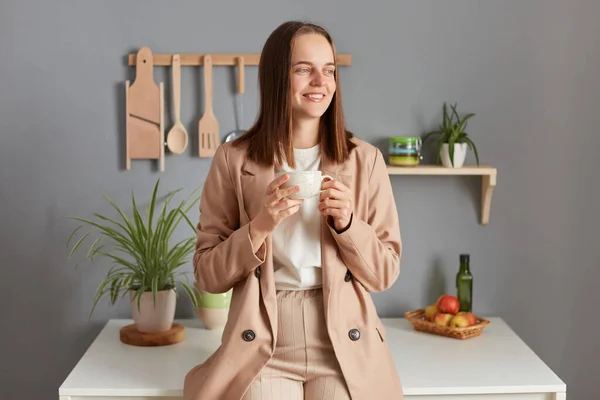 Dreamy Smiling Positive Woman Brown Hair Wearing Beige Jacket Standing — Stock Photo, Image