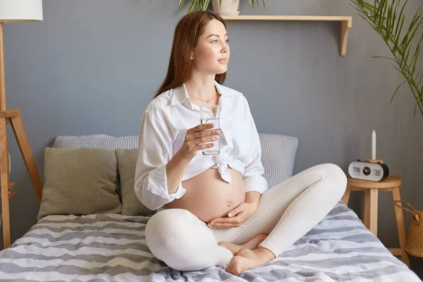 Attractive Dreamy Pregnant Woman Bare Belly Wearing White Clothing Sitting — Stock Photo, Image