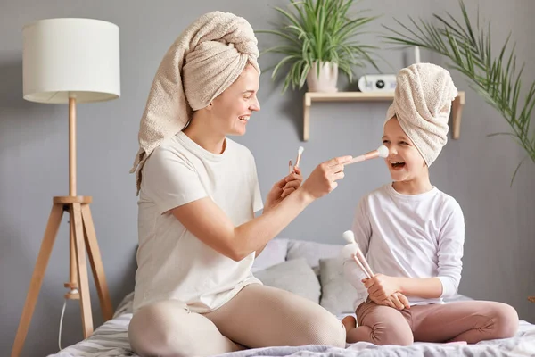 Indoor Shot Smiling Joyful Cheerful Mother Daughter Towels Bed Home — Stock Photo, Image