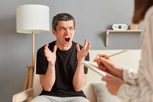 Young Caucasian Man Consultation Psychologist Office Feeling Angry Mad Screaming — Stock Photo, Image