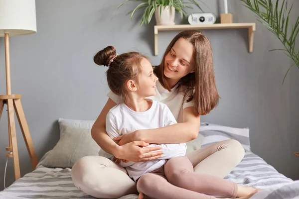 Smiling Adult Woman Embraces Her Cute Little Girl Beautiful Bedroom — Stock Photo, Image
