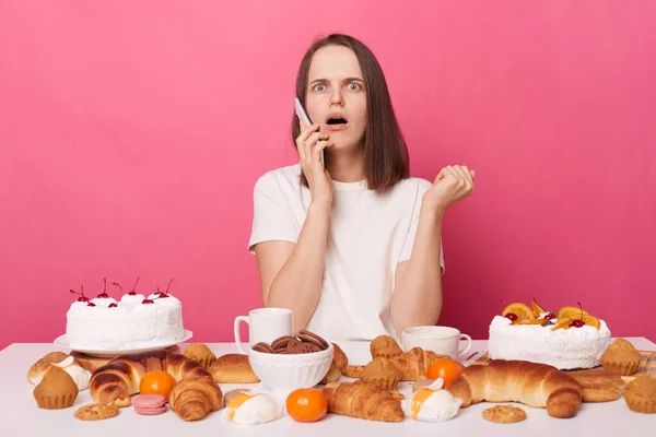 Shocked Woman Wearing White Shirt Sitting Festive Table Various Desserts — Stock Photo, Image