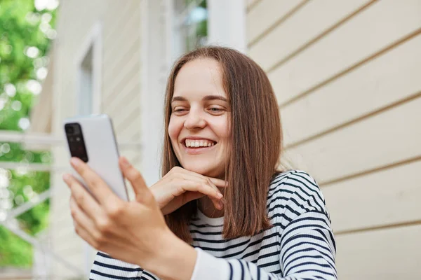 Smiling Happy Woman Wearing Striped Shirt Using Phone Posing House — Stock Photo, Image