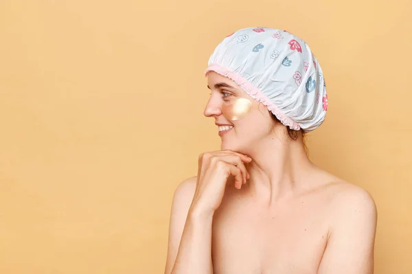 Smiling Happy Woman Wearing Shower Cap Eye Patches Isolated Beige — Stok Foto