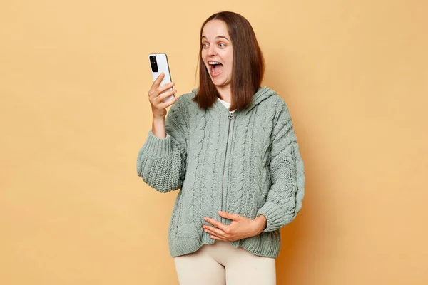 Overjoyed Pregnant Woman Wearing Knitted Warm Sweater Standing Isolated Beige — Stock Photo, Image