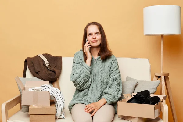 Unhappy Sad Woman Sitting Sofa Opening Carton Box Talking Mobile — Stock Photo, Image