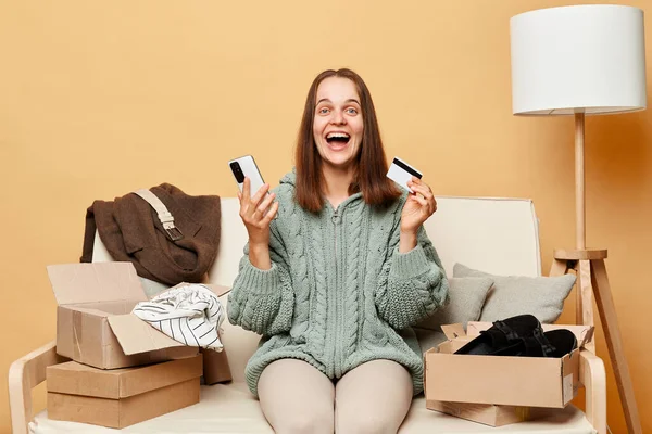 Overjoyed Woman Wearing Knitted Sweater Ordered Clothes Boxes Sitting Home — Stock Photo, Image