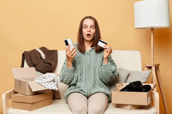 Shocked Woman Wearing Knitted Sweater Ordered Clothes Boxes Sitting Home — Stock Photo, Image