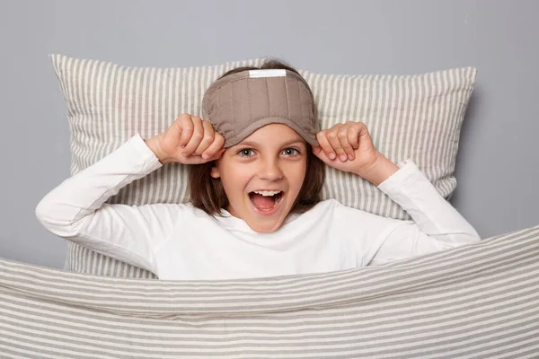 Excited Cute Girl Wearing Sleep Eye Mask Resting Pillow Blanket — Stock Photo, Image